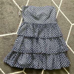 Navy blue and white tiered strapless mini dress with boning